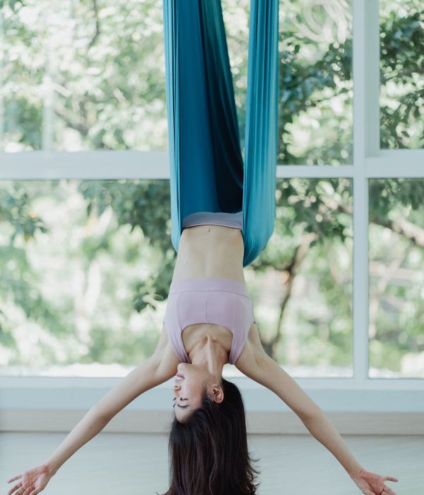 Woman in a graceful yoga pose, finding balance and harmony.